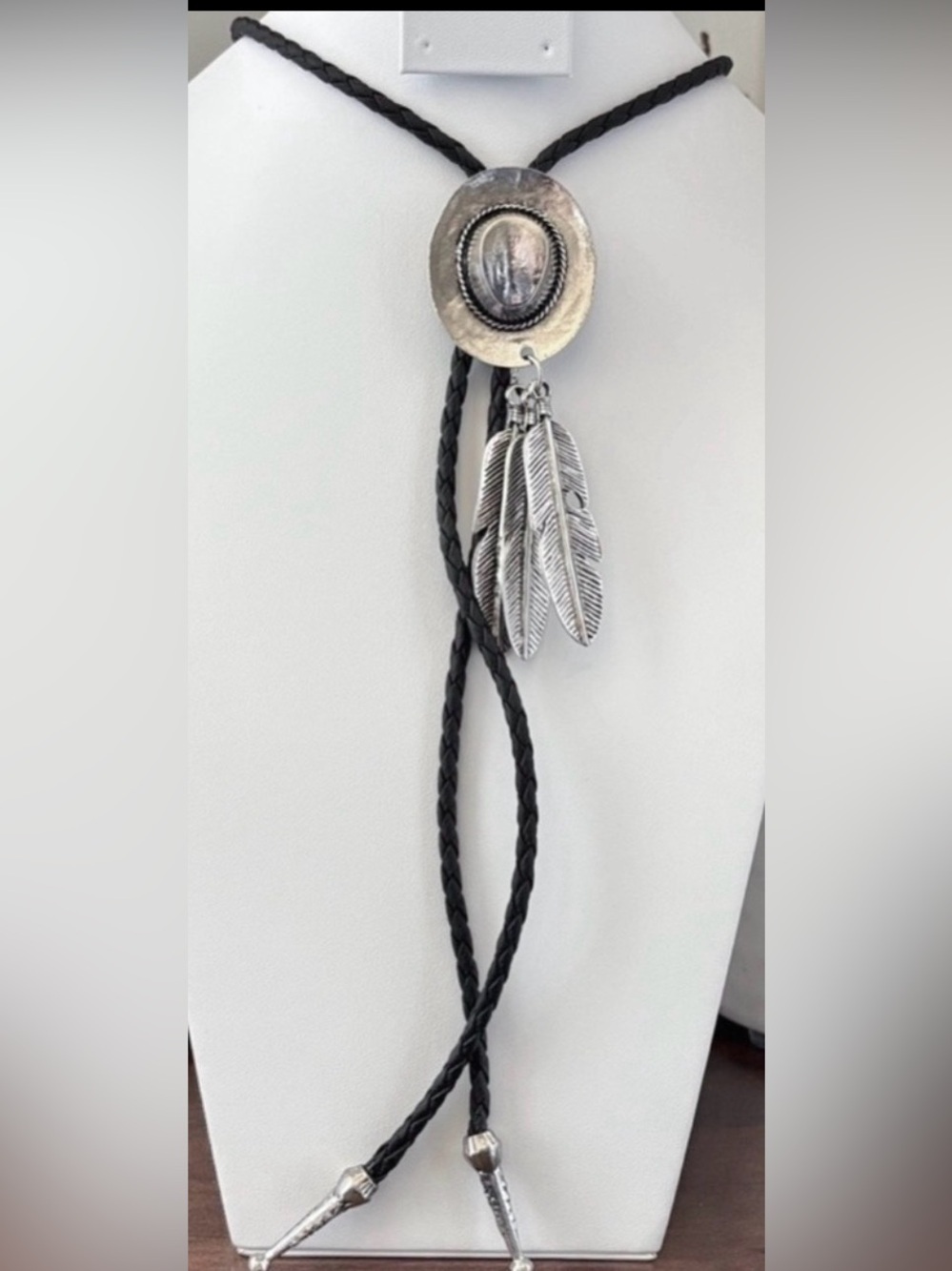 YMI Bolo Tie,silvertone cowboy hat with 3 feathers,black necklace